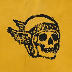 a drawing of a skull with wings on it's head in black and yellow