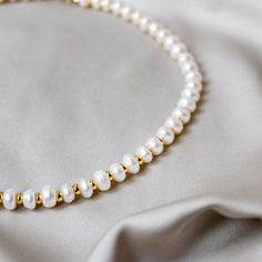 Pearl Necklace -  Elegant Classic Pearl Necklace - Layered Necklace - Wedding Necklace Item Details: ⭐ This necklace is 40cm long. You can request your own desired length if this is not the length you like.  ⭐ The necklace is made with coin freshwater pearls and 18k gold plated gold beads. ⭐ Freshwater pearls are also a natural product, and the shape and colour vary slightly. ⭐ Product colour may slightly vary due to photographic lighting sources or your monitor settings. Please take that into c Dainty Handmade Pearl Necklace For Anniversary, Pearl Necklaces With Round Beads For Anniversary, Adjustable Round Beads Pearl Necklace For Anniversary, Adjustable Pearl Necklace With Round Beads For Anniversary, Anniversary Pearl Necklaces With Round Beads, Handmade Bridal Necklace With Round Beads For Anniversary, Beaded Necklaces For Anniversary, Handmade Pearl Beaded Necklace For Anniversary, Adjustable Pearl White Pearl Necklace For Anniversary