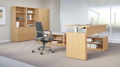 an office with a desk, chair and bookcase in the middle of the room