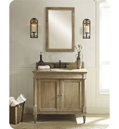 a bathroom with a sink and mirror next to a basket on the floor in front of a window