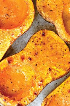 baked sweet potatoes on a baking sheet ready to be cooked in the oven for dinner