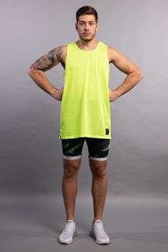 BORN IN THE GYM, BRED FOR THE STREETS. Our high performance over-sized tank top with custom AeroMesh fabric will take you from a workout to the mean streets. Tough, breathable and sweat-wicking, it’s designed to wear over meggings or with jeans for an urban edge. Description: Neon Yellow AeroMesh Tank Top with Black Logo Super lightweight Sweat Wicking High Performance Polyester Machine Wash Cold STYLE WITH Kapow’s Original Range leggings for Showstopping designs and comfort Compression shorts f Mean Streets, For The Streets, Casual Street Wear, Wet Look Leggings, Metallic Leggings, Mens Leggings, Mens Compression, Compression Fabric, Compression Shorts