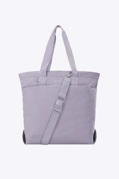 Discover our new utility tote bag in lavender. Perfect for work, travel, or everyday use, shop now for a durable travel tote bag designed to meet all your needs. Functional Everyday Canvas Bag With Adjustable Strap, Functional Canvas Bag With Adjustable Strap For Everyday, Everyday Functional Cotton Shoulder Bag, Daily Use Canvas Bags With Adjustable Straps, Versatile Everyday Canvas Softback Bag, Versatile Tote Canvas Bag For Daily Use, Everyday Cotton Bag With Adjustable Strap, Everyday Rectangular Canvas Bag With Adjustable Straps, Practical Everyday Bags With Adjustable Straps