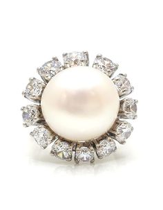 All of the products are MADE TO ORDER in India. They are handcrafted by me and my expert artisan team. Make a statement with our elegant White Freshwater Pearl Ring! Handmade with love, this 925 Sterling Silver ring dazzles with 5A grade Cubic Zirconia diamonds. Perfect for cocktail parties or everyday elegance. Be a show-stopper with our Halo Design Pearl Ring!" SKU: AARC_202 💍Details: *  Gemstone Grade: AAAAA (Natural Diamond Coated) * Base Metal: 925 Sterling Silver * Stone: Cultured Pearl * Shape: Round * Carat Weight: 2.50 ct  * Style: Edwardian PLEASE NOTE 📢 *   This product is completely eco-friendly and non-aggressive to all skin type.  *   It does NOT contain nickel, cadmium, or lead. Explore our stunning collection here: https://etsy.me/3dMqXXW Share your love and experiences w Pearl Halo, White Pearl Ring, Heritage Jewellery, Freshwater Pearl Ring, Historical Jewellery, Halo Design, Jewelry Fashion Trends, Ruby Jewelry, Fresh Water Pearl