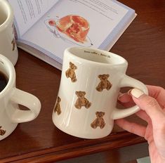 two coffee mugs with teddy bears on them