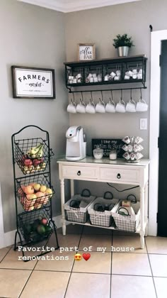 a coffee bar in the corner of a room with baskets and cups on top of it