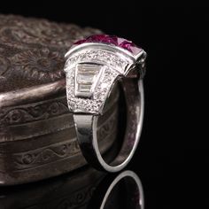 Gorgeous Antique Art Deco Platinum Diamond and French Cut Ruby Ring. A beautiful Art Deco ring finely made and features 4 large French cut rubies going down the center. The ring is also numbered. Item #R0762 Metal: Platinum Diamonds: Approximately 1 cts Ruby: Approximately .80 cts French Cut Weight: 5.1 Grams Size: 5 1/4 Measurements: 12.1 mm long and 5 mm off the finger. Layaway: For your convenience, we will be happy to provide layaway payment options. Please contact us to work out a layaway p Art Deco Ruby Ring For Formal Occasions, Vintage Gia Certified Ruby Ring For Formal Occasions, Gia Certified Baguette Cut Ruby Ring For Anniversary, Luxury Ruby Ring With Diamond Baguette Cut, Luxury Diamond Ruby Ring With Baguette Cut, Art Deco Ruby Ring With Prong Setting For Wedding, Art Deco Ruby Ring For Anniversary, Art Deco Ruby Wedding Ring, Art Deco Red Diamond Ring