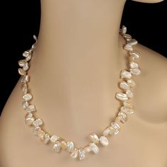 This is part of Chairish’s Fine Jewelry assortment.  Chic 27-Inch Peachy Freshwater Pearl Necklace – A Wardrobe Essential  Add a touch of elegance to your look with this lovely 27-inch freshwater pearl necklace. Featuring slightly graduated pearls in a soft, peachy hue, this necklace exudes a warm luster and radiant glow that complements any outfit. Its timeless design makes it a versatile favorite, whether you're dressing up for an event or adding sophistication to your everyday style.  Secured Luxury Refined Yellow Gold Pearl Necklace, Luxury Yellow Gold Refined Pearl Necklace, Classic Pear-shaped Baroque Pearl Necklace, Classic Baroque Pearl Pear-shaped Necklace, Luxury Gold-tone Elegant Pearl Necklace, Freshwater Pearl Necklaces, Wardrobe Essentials, Fresh Water, Freshwater Pearls