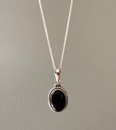 Sterling silver oval black onyx necklace. Also available in other stones. Gift box available for purchase. If you would like your jewellery to arrive in a gift box Search GIFTBOX to purchase. Buy multiple items and only pay for one shipping cost. 🛍️ Subscribe to our email list for exclusive discounts and GET 20% OFF your next order in our Etsy Shop! Copy and paste this link into your browser to join: https://bit.ly/3BzMfDB Etsy Necklaces Unique, Onyx Pendant, Sweet Jewelry, Black Onyx Necklace, Oval Necklace, Indian Jewelry Sets, Bead Charms Diy, Onyx Necklace, Classy Jewelry