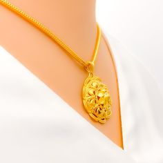 Indulge in luxury with our Decadent Fancy 22k Gold Pendant, featuring intricate detailing and a stunning design. Crafted from 22k yellow gold with a weight of 4.7 grams, this pendant is the perfect finishing touch to any high fashion look. At a length of 1 inch, it is a great statement piece. PRODUCT DETAILS Gold Purity(karat): 22k Gold Weight(grams): 4.7 Item Finish: Yellow Gold Pendant Length: 1" Chain: Not Included Exquisite Gold Plated Pendant Necklace, Formal 22k Gold Pendant Necklace, Exquisite Gold Necklace With Large Pendant, Elegant 22k Gold Round Pendant Jewelry, 22k Gold Necklace With Round Pendant And Intricate Design, 22k Gold Round Pendant Necklace With Intricate Design, Exquisite 22k Yellow Gold Necklace, 22k Gold Necklace With Intricate Round Pendant, Gold Necklace With 22k Gold Flower Pendant