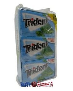 three packs of tridentt toothpaste sitting on top of eachother