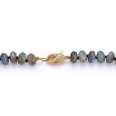 Faceted labradorite culminates with a cheeky crab claw clasp. Labradorite is a stone of transformation. Associated with the throat chakra, it can connect a person with the divine and help discover their true self. Also known as a protector stone, labradorite is believed to shield against misfortunes. Made to order. Labradorite Gemstone Beads Necklace For Meditation, Spiritual Labradorite Jewelry With Gemstone Beads, Spiritual Labradorite Gemstone Necklace, Hand-strung Labradorite Gold Jewelry, Artisan Labradorite Gemstone Bead Jewelry, Oval Labradorite Necklace With Natural Stones, Adjustable Labradorite Gemstone Beaded Necklaces, Faceted Labradorite Necklaces For Jewelry Making, Faceted Labradorite Round Beads Jewelry