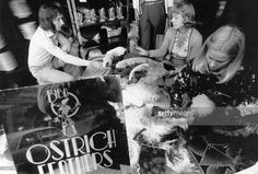 Customers buying ostrich feathers during the closing-down sale at Biba's, Kensington High Street, London. Biba London, 70s Fashion Icons