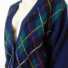 "Vintage Koret Tartan plaid button front navy blue cardigan Argyle sweater, wool blend, Made in Hong Kong. A great preppy cardigan with a button front.Navy blue with green, black, yellow, red, and white. A classy academic look! The tag reads size small but please refer to measurements below. Measured flat Shoulders 18\" Sleeves 22\" Under arms 21\" Length 26\"" Blue Wool Cardigan For Fall, Fitted Argyle Pattern Sweater For Fall, Fall Fitted Argyle Sweater, Fitted Argyle Sweater For Fall, Fall Season Argyle Sweater, Classic Argyle Pattern Sweater For Fall, Classic Plaid Long Sleeve Cardigan, Fitted Plaid Long Sleeve Sweater, Fitted Long Sleeve Plaid Sweater