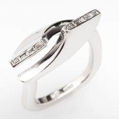 a couple of rings sitting on top of each other in front of a white background