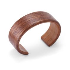 Wood Bracelet - A striking piece for those who prefer natural and alternative materials, this distinctive, steam-bent cuff bracelet is crafted from reclaimed wood and showcases the simple beauty of the grain. The piece comprises two sheets of laminated, steam-bent wood and is finished with multiple coats of hand-rubbed varnish. Each is unique and will vary.<br><br>Available in an interior circumference of 6.5 only. Visit the video tab of the artists page for additional information on Handmade Brown Cuff Bracelets, Brown Waxed Finish Cuff Bracelet, Modern Handmade Brown Cuff Bracelet, Artisan Brown Cuff Bracelet, Wood Cuff Bracelet, Wooden Bracelet, Wood Bracelet, Bent Wood, Simple Beauty