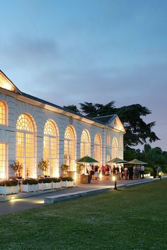 a large building with many windows lit up at night