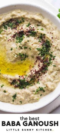 the best baba ganoush recipe is served in a white bowl with parsley on top