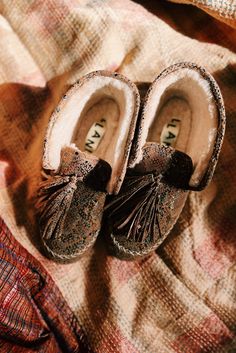 **THIS ITEM IS ON PRE-ORDER ESTM SHIPPING OCT 15TH Our genuine Suede Snake Moccasin with large hand tied tassel, adds a bit of eclectic luxury to your day. Lined in super soft genuine shearling, this fun shoe is cozy too. Style them folded down like a moccasin, or up like a bootie. This year our genuine shearling mocs have a new and improved fit to be more comfortable than ever! We also added an outdoor sole so we can all take these babies to the streets! You know you have been walking the dog i Eclectic Luxury, New And Improved, Outdoor Wear, Dog Walking, Shoe Game, Shoe Box, Nice Shoes, Moccasins, Bootie