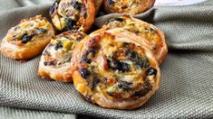 several pastries sitting on top of a cloth