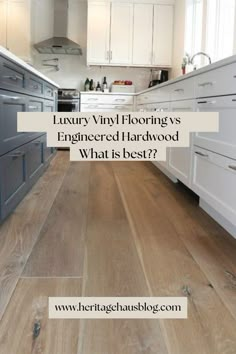 a kitchen with white cabinets and wood floors is featured in the article luxury vinyl flooring's engineering hardwood what is best?