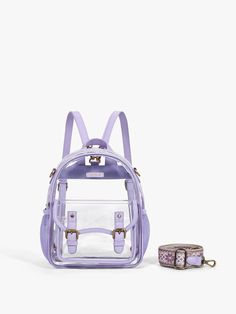 Upgrade your event style with our Lila's Clear Mini Backpacks, a chic and compliant accessory. This chic accessory complies with the clear bag policy. You can pass through security checks quickly and easily at any sporting events, concerts, festivals or any other outdoor activities. 1. Made of premium PVC and vegan leather 2. Gold-colored hardware, waterproof and durable, easy to clean. 3. A transparent and spacious interior makes it easier to access your essentials 4.Adjustable embroidery patte Cheap Clear Backpack With Transparent Straps, Cheap Clear Bags With Adjustable Strap, Cheap Everyday Backpack With Transparent Straps, Cheap Clear Plastic School Bags, Cheap Trendy Clear Satchel, Cheap Clear Backpack For School, Cheap Bags With Transparent Straps For Everyday Use, Cheap Clear Backpack For Everyday Use, Cheap Clear Bag For Back To School