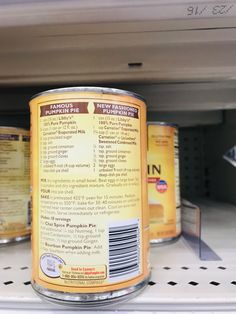 an open can of canned food on a shelf