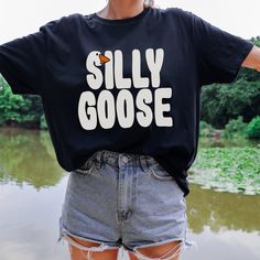 ★Silly Goose! Cute Funny Unisex Softstyle T Shirt Also available as a crewneck sweatshirt! (Separate listing) ★Unisex soft-style t-shirt ★100% cotton for solid colors. Heather colors and sports grey include polyester. ★No side seams ★The collar is made with ribbed knitting to prevent curling damage. ★Tear-away label ★Runs true to size Silly Goose Tshirt, Silly Shirt Ideas, Fall Crew Neck T-shirt With Letter Print, Casual Funny Text Crew Neck T-shirt, Casual Crew Neck T-shirt With Funny Text, Fall Crew T-shirt With Text Print, Fall Crew Neck T-shirt With Text Print, Band Merch Crew Neck T-shirt For Fall, Funny Crew Neck T-shirt For Fall