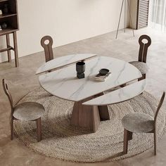 a round marble table with chairs around it