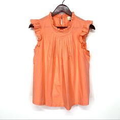 Keyhole Back. Cotton Lyocel, No Stretch. New Without Tags. Size Small. Measurements Shown. Peach Tops For Spring Daywear, Orange Sleeveless Top For Brunch, Feminine Orange Tops For Brunch, Feminine Orange Top For Brunch, Peach Ruffled Tops For Spring, Casual Peach Tops With Ruffles, Chic Orange Blouse With Ruffles, Chic Orange Ruffled Blouse, Orange Short Sleeve Blouse With Ruffles