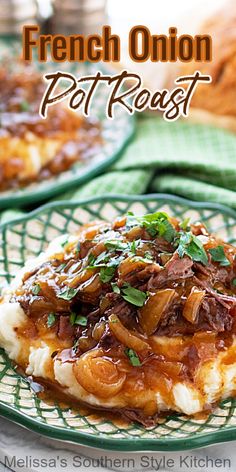 a green plate topped with mashed potatoes covered in gravy and meat sauce