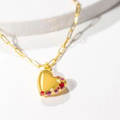 This gold Heart Locket Necklace opens to reveal your personalized message of the moment. The Ruby, Amethyst & Crystal-style enamel creates an intriguing look. Ruby Locket Necklace, Heart Locket Bracelet, Silver Heart Jewelry, Chain Locket, Gold Heart Locket, Gold Locket Necklace, Arrow Bracelet, Arrow Earrings, Gold Bracelet Set