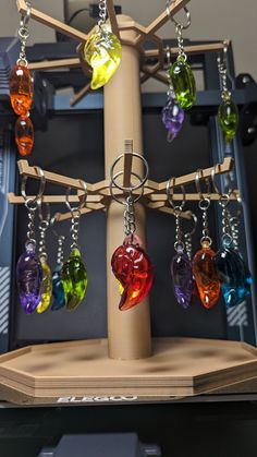 a tree with many different colored glass items hanging from it