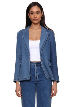 Elevate your style game with this stunning denim blazer - the ultimate wardrobe essential. Upgrade your traditional blazer game with this piece. Featuring two front pockets and a button for a sleek and chic closed look. Its oversized, trendy design is sure to make a statement. Model is 5'10" wearing a size XS, Shell: 100% Cotton, Lining: 100% Polyester, Machine wash cold, Line dry,