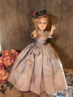 Oh this old gal looks like Mary Poppins used to . Wearing a "gown" and tangled thinning red hair!  Yep her head swivels, arms move. Stands a proud  7inches. Mary Poppins, Plum Color, Vintage Wear, Hard Plastic, Doll Toys, Red Hair, Action Figures, Bathing Beauties, Dolls