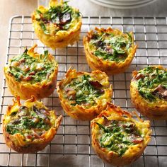 mini quiches with spinach and cheese on a cooling rack