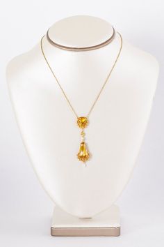 Got YELLOW?  We do in this outstanding brighter than bright 18 k yellow and rose gold Victorian citrine and seed pearl dangle pendant necklace.  Each citrine stone is cradled within a floral wreath design.  So elegant and lively at the same time!  Would you wear this on your wedding day?  We think it would be the perfect antique bridal adornment but we also think it could be your new signature piece!  Antique Necklace - Antique Victorian 1890-1900 18k Two-Tone Citrine & Seed Pearl NecklaceCi Victorian Yellow Gold Dangle Jewelry, Yellow Gold Drop Necklace With Pearl Pendant, Art Nouveau Yellow Gold Jewelry With 17 Jewels, Gold Art Nouveau Necklace With Gemstone, Art Nouveau Gold Necklace With Gemstone, Wedding Yellow Gold Briolette Drop Necklace, Art Nouveau Yellow Gold Pendant Jewelry, Antique Yellow Gold Jewelry With Detachable Pendant, Victorian Necklace With Detachable Pendant