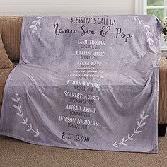 a couch covered in a wedding program blanket