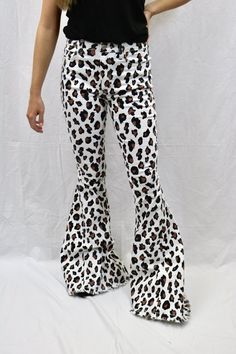 These leopard flared denim pants are sure to be a show stopping staple piece. Pair with our black ribbed tank for a stand out outfit!! Model is wearing a size small. Edgy White Bottoms For Fall, Trendy Summer Flare Jeans With Flared Hem, Trendy High Waist Flares For Night Out, Trendy High-waist Flares For Night Out, Trendy Stretch Cotton Flares, Stretch Flare Jeans For Night Out, Trendy Summer Flares With Flared Hem, Fall Flare Jeans For Night Out, Trendy Flared Hem Summer Pants