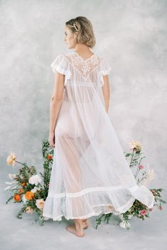 "Vintage 60s Cream Peignoir Bridal Wedding Lingerie Dress Embroidered Beaded M Ties at the neck -Measurements- Estimated Size: Medium Bust: 36\" Waist : free Hips: free Length: 42\" Sleeve: 4\" Model is 5'9 and measures 32/25/34" White Lace Nightgown For Wedding, White Lace Wedding Nightgown, Sheer Lace Wedding Robe, Fitted Sheer Robe For Wedding, Sheer Lace Wedding Night Gown, Delicate Lace Nightgown For Weddings, Delicate Lace Wedding Nightgown, Fitted Lace Trim Nightgown For Wedding, Sheer Nightgown For Wedding