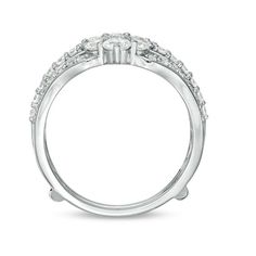 a white gold ring with three stones on the side and two rows of diamonds in the middle