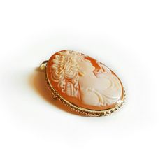 Vintage cameo brooch antique gold cameo brooch and by DonadioCameo Collectible Cameo Pendant Brooches, Cameo Pendant Brooch For Wedding, Cameo Pendant Brooches For Wedding, Round Cameo Brooch As Gift, Round Cameo Brooch Gift, Oval Cameo Brooches As Gift, Cameo Jewelry, Vintage Cameo, Cameo Brooch