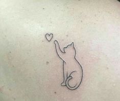 a cat with a heart tattoo on its back