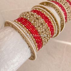 A Pair of 2 medium sized stacks of luxurious antique Gold bangles with pretty strawberry red shades, finished with intricate detailed Champagne Crystal bangles and pearl details. This will make the perfect stack for any Bride or those wanting to make a statement. Pair this with our Rubal Choker Set. Sold as a set for both arms only. Ready to Ship! Antique Gold Bangles, Cristal Champagne, Bridal Survival Kit, Hand Harness, Bangle Box, Red Shades, Bridal Choker, Bridal Necklace Set, The Bangles