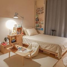 a bedroom with a bed, desk and chair in it