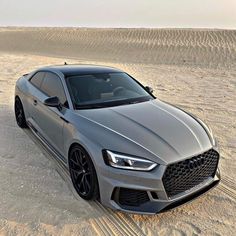 a grey car parked in the desert