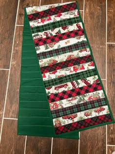 a quilted christmas table runner on the floor