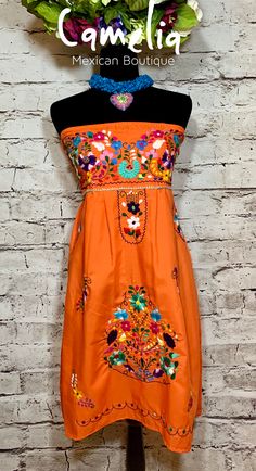 Traditional Mexican Puebla dress Tehuacán style. Frontal embroidery in fine cotton thread. Each dress has a unique design. Made of 100% poplin fabric with heart shape neckline. Match it with one of our Mexican Accessories: Espadrilles, Necklace, Shawl, or Mexican Clutch. Perfect for any Mexican Themed party celebration. Look at our entire Puebla Collection here. Please note that due to items being hand-made and hand embroidered, no two items will be the same. The embroidery pattern and color may Birthday Party Outfit Women, Mexican Fiesta Dresses, Mexican Accessories, Mexican Boutique, Mexican Themed Party, Puebla Dress, Mexican Quinceanera Dresses, Mexican Birthday Parties, Mexican Wedding Dress