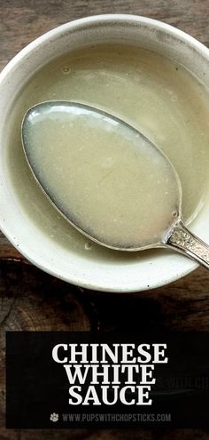 a spoon in a white bowl with the words chinese white sauce on it's side