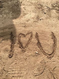 the word love is written in the sand